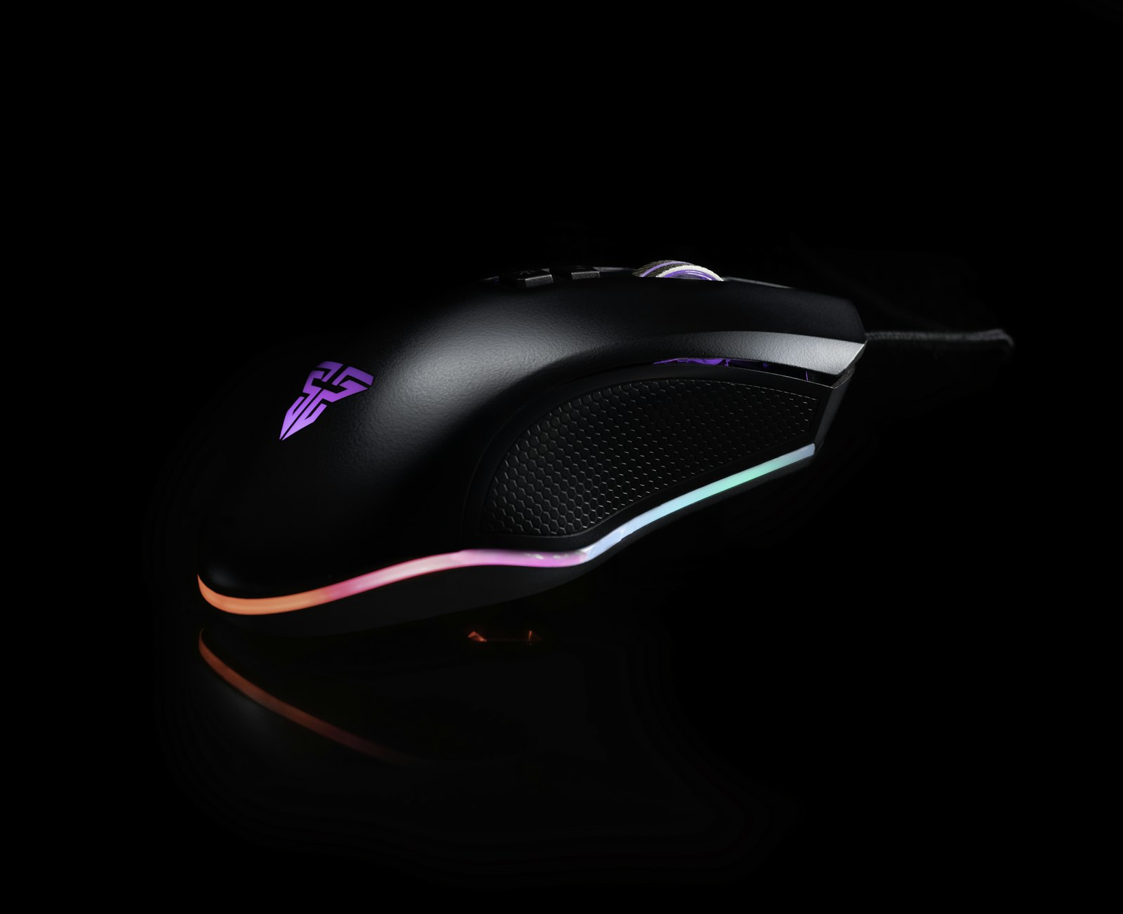 Black and red gaming mouse on desk